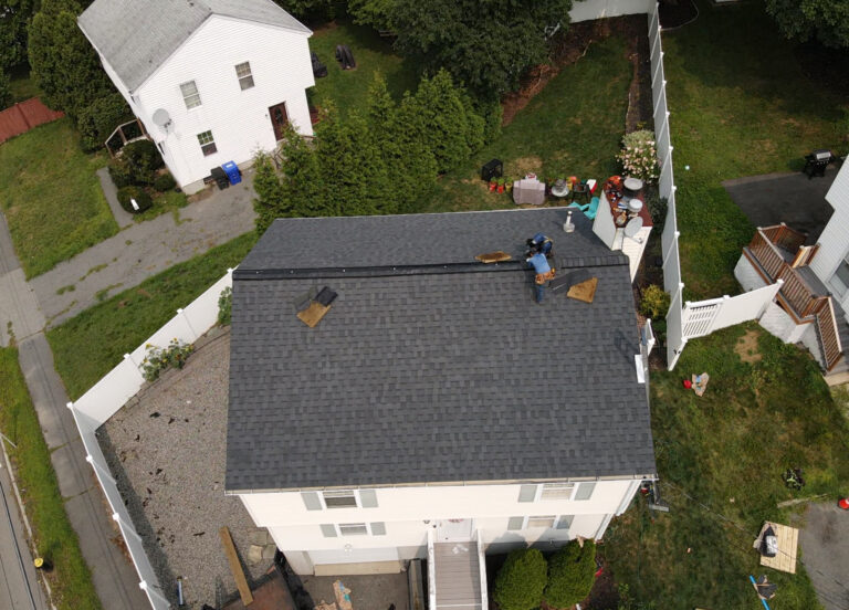 Drone roof inspection showing an asphalt shingle roof on a residential home in Boston, MA.