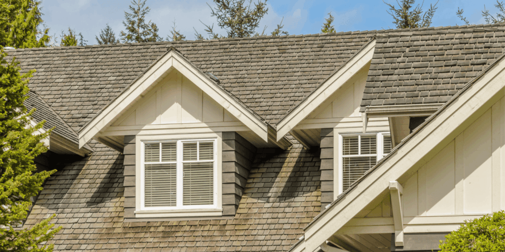 Clean and well-kept shingle roof on a modern home, highlighting proper roof maintenance and seasonal roof care