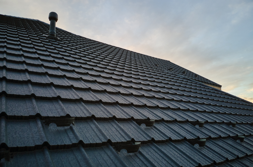 Metal residential roof after roof repair, showing durable panels designed to protect the home from rain, wind, and harsh weather