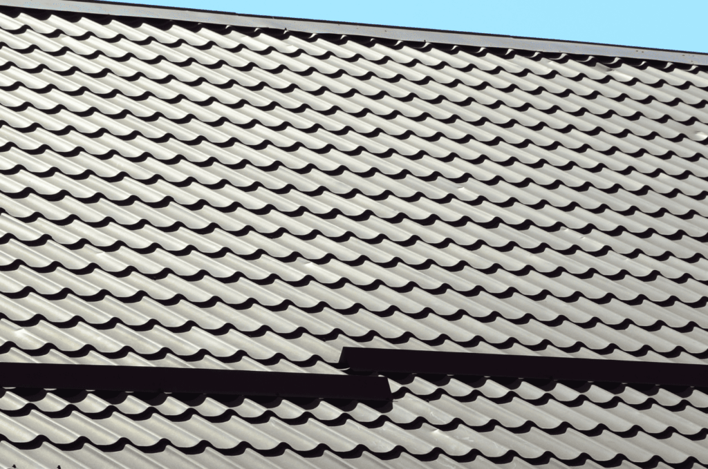Durable metal roofing materials installed on a modern roof, designed to protect the home from rain, wind, and harsh weather