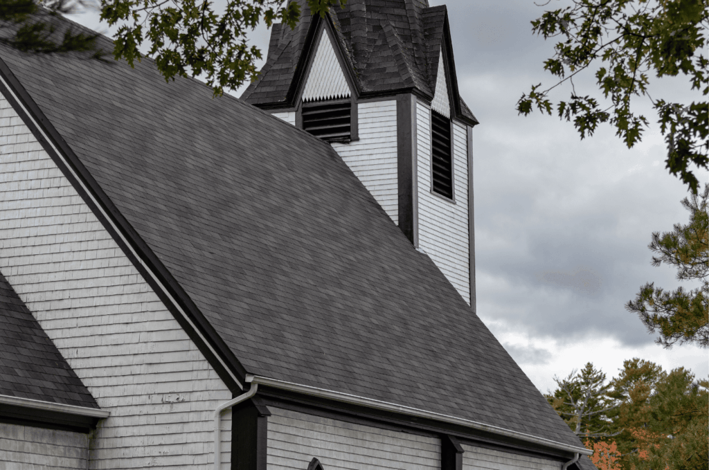 Steep church roof built with long-lasting roofing materials that provide strong protection and classic architectural style.