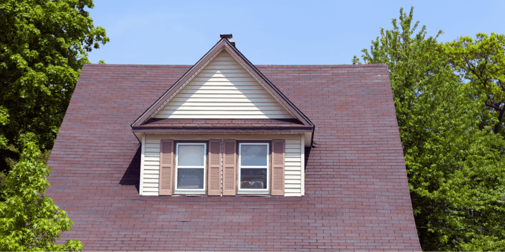 Residential home roof covered with quality asphalt shingle roofing materials designed for durability and weather protection.