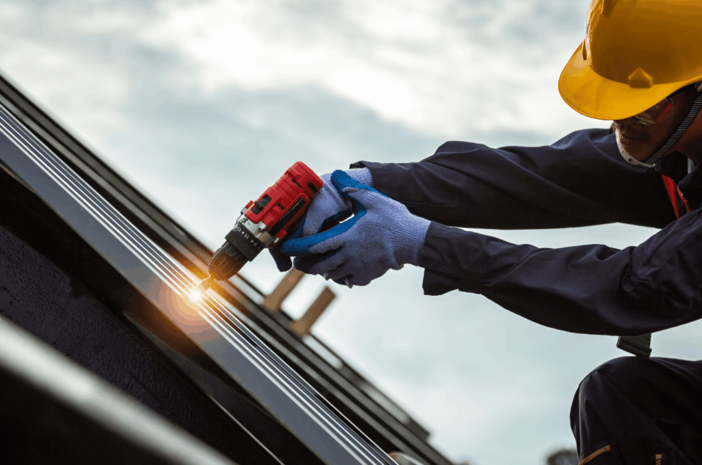 constructor repairing  roof that was damaged from low maintenance and cleaning.