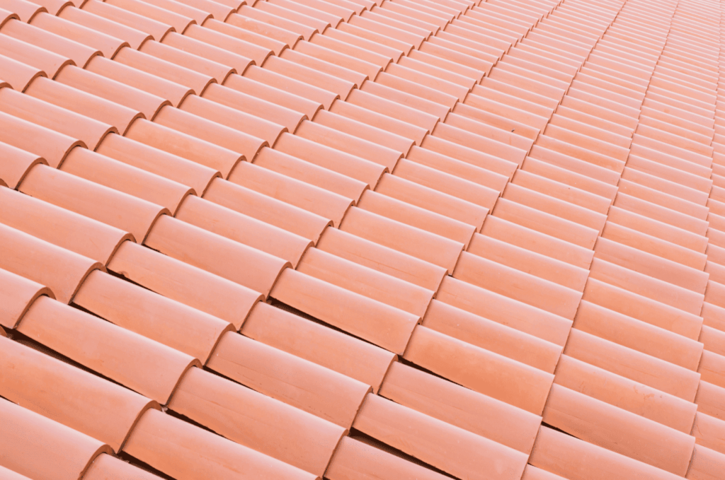 Close-up view of clay tile roofing installed in neat rows, designed to provide strong protection and long-lasting durability