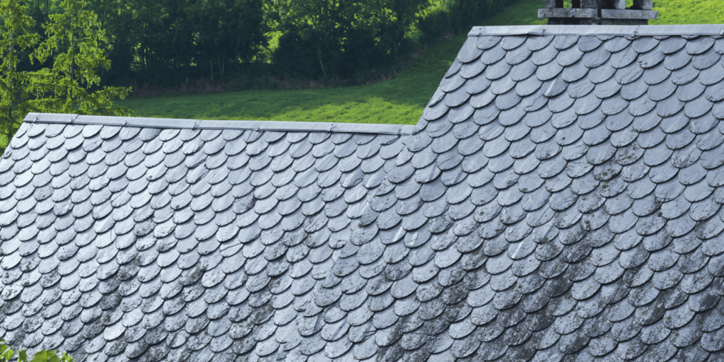 Residential roof covered with slate roofing tiles, showing durable materials that help protect the home from rain and wear