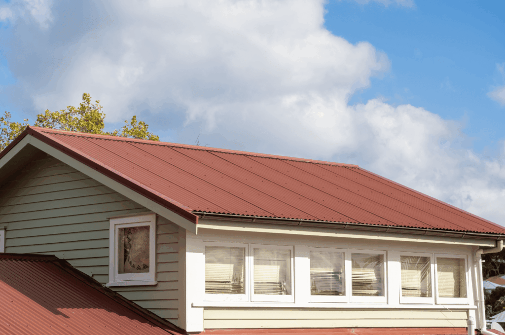 Metal roof on residential home displayed during a roof inspection to check panels, fasteners, and weather protection