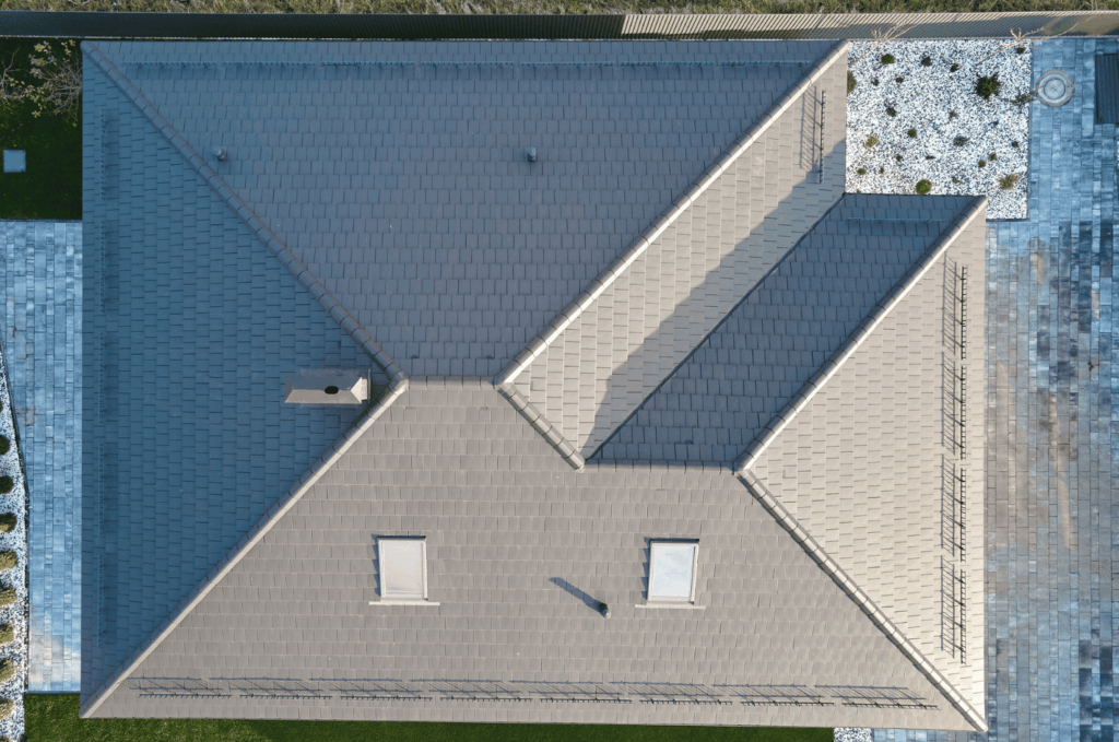 Top view of a large gray roof captured during a drone roof inspection to check roof condition and overall layout