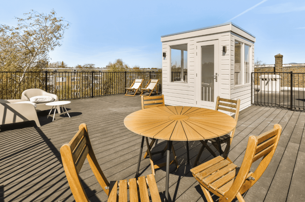 Modern roof deck install with outdoor seating, wood flooring, and a private rooftop space for relaxing outdoors 
