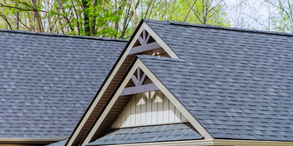 Freshly cleaned asphalt shingle roof on a residential home, highlighting the benefits of routine roof cleaning