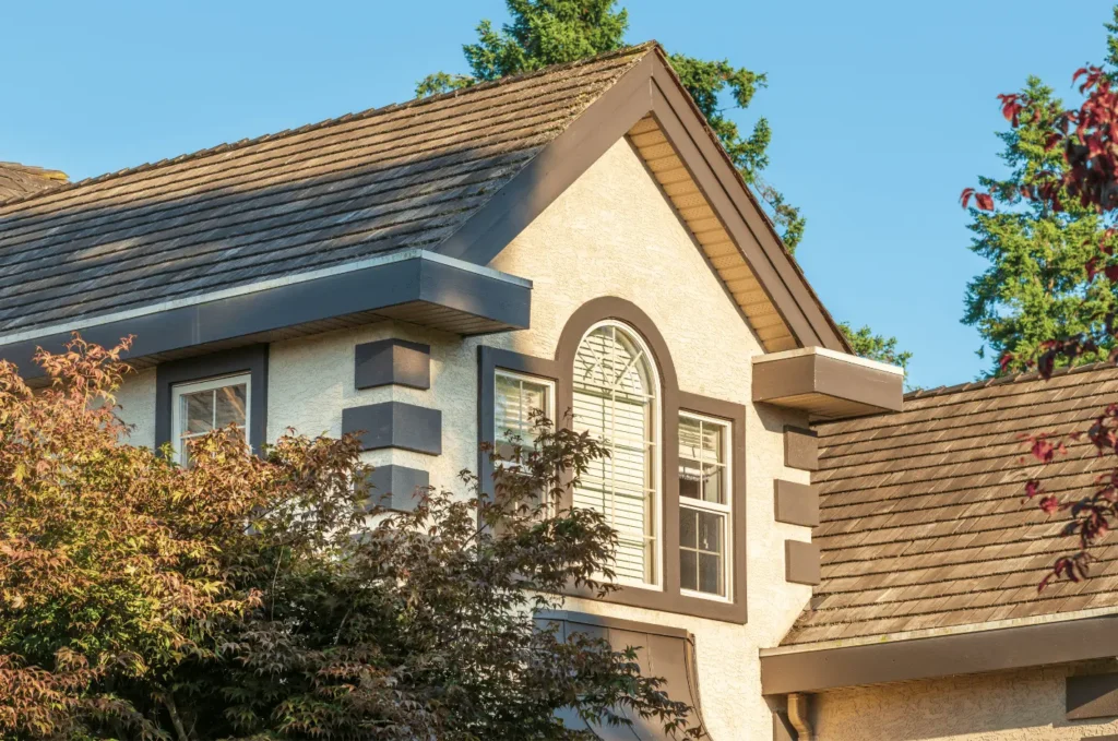 Home with aging roof shingles showing areas that may require shingles repair to restore protection and appearance