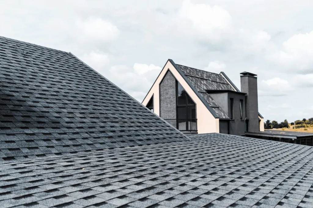 Close-up of asphalt shingles with visible granules, highlighting the materials commonly addressed during shingles repair