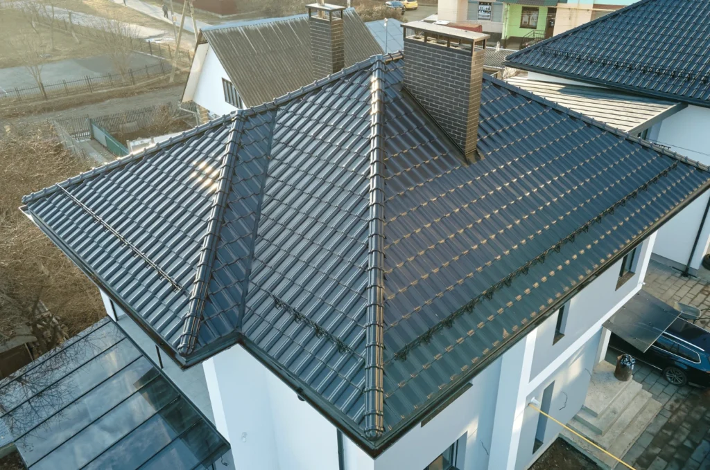 Modern metal roofing system installed on a multi-slope home, providing durability, energy efficiency, and clean lines