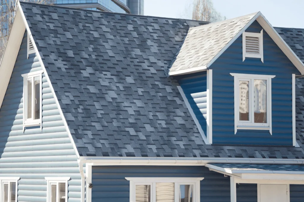 Asphalt shingle roofing system on a two-story home, combining reliable performance with an attractive exterior design