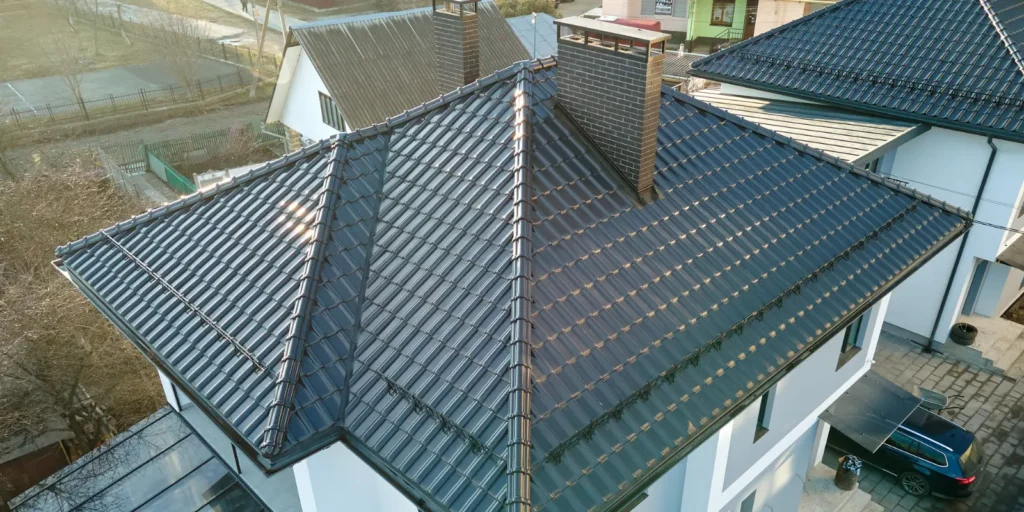Well-maintained metal roof protecting the home from water intrusion and potential emergency roof leak issues