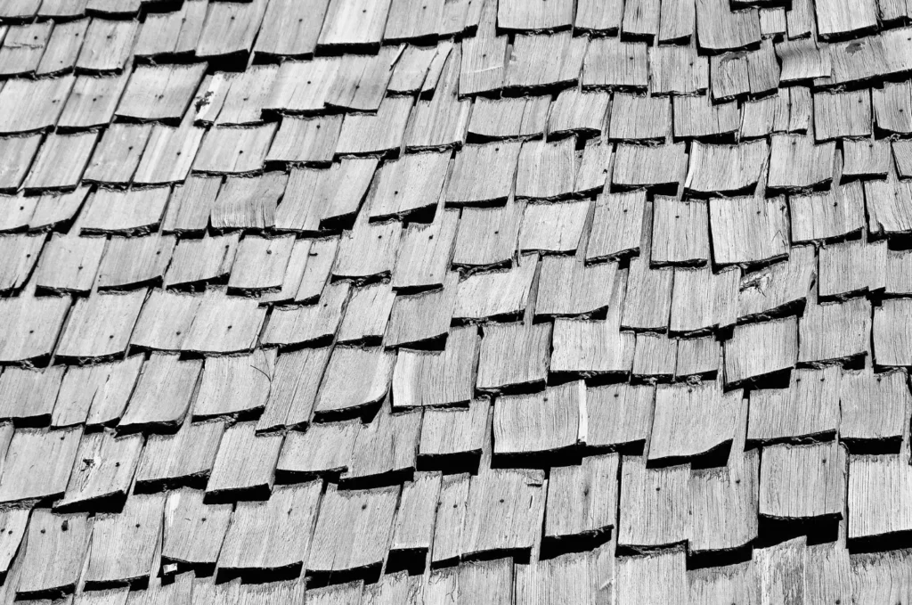 Cedar shake roofing, showing natural wood tones and a classic design that blends with the landscape
