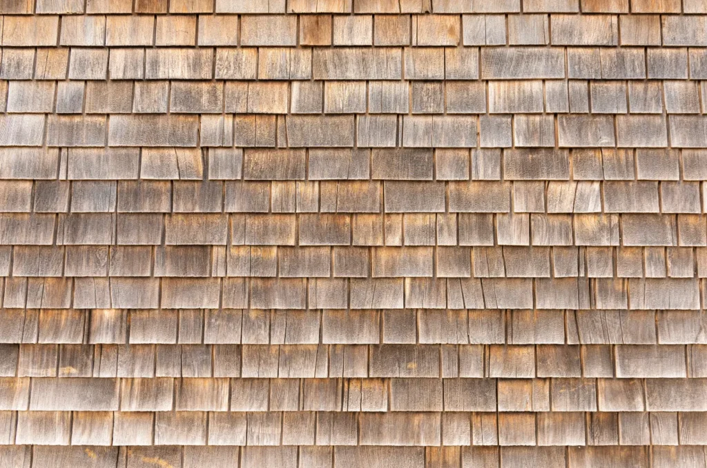 Close view of cedar shake roofing installed in overlapping rows for a strong and traditional roof finish