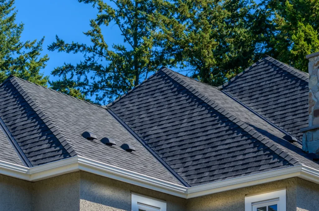 Close view of an asphalt shingle roof showing layered shingles installed for reliable weather resistance