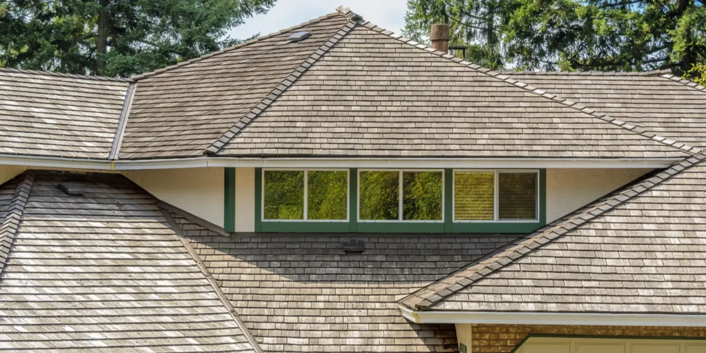 Shingle roof with clean, even rows designed to protect the home from rain, wind, and changing weather