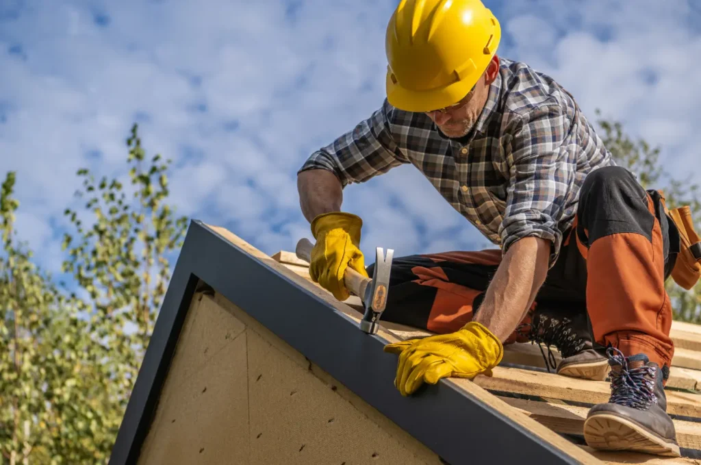 Roofing contractor working on a home roof to complete repairs and improve protection