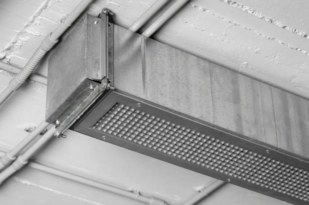 Soffit vent running along the roof edge beneath the overhang of a house