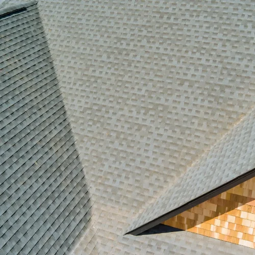 Large shingle roof with clean lines and valleys designed to prevent roof leak issues during heavy rainfall