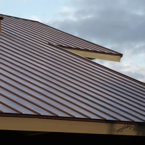 Brown metal roofing system with secure seams built to resist moisture and prevent roof leak problems